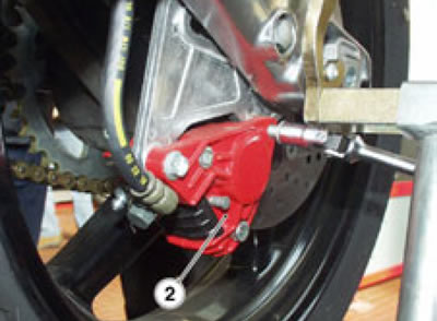 from below, on the rear part, for the rear brake…