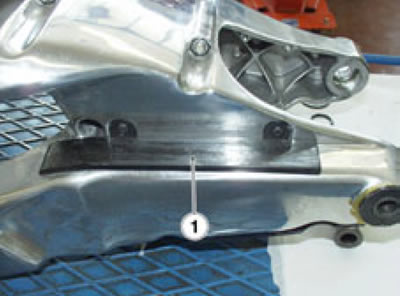 Check the chain slider (1) for damage or wear.…