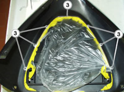 Release and remove the seven screws (3).