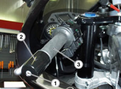 Fit the nozzle of an air gun between twistgrip…