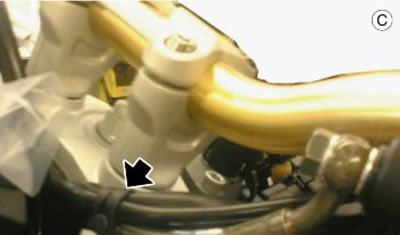 Fasten the left switch cable harnesses with a…