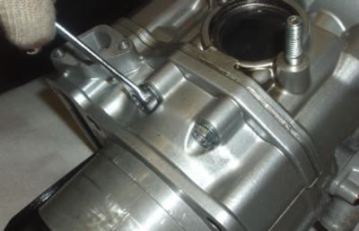 Undo and remove the screws on the outlet side.