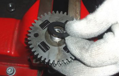 Remove the timing system gear from the camshaft.