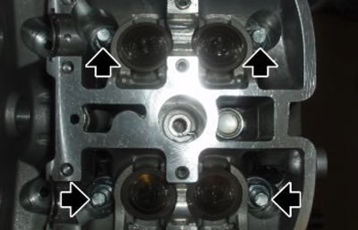 Remove the three nuts fastening the cylinder head…