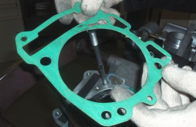 Remove the gasket between the cylinder and the…