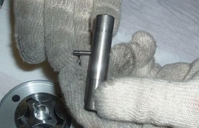 Collect the lock pin from the shaft.