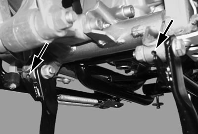 Grease bearing bushes (arrows) with a grease gun…