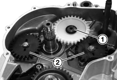 Remove circlip (1) from idler gear.