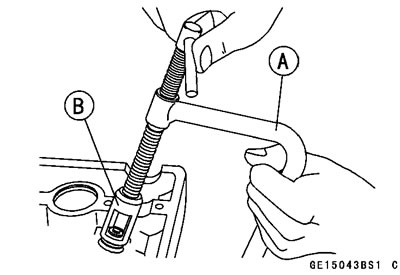 Using the valve spring compressor assembly,…
